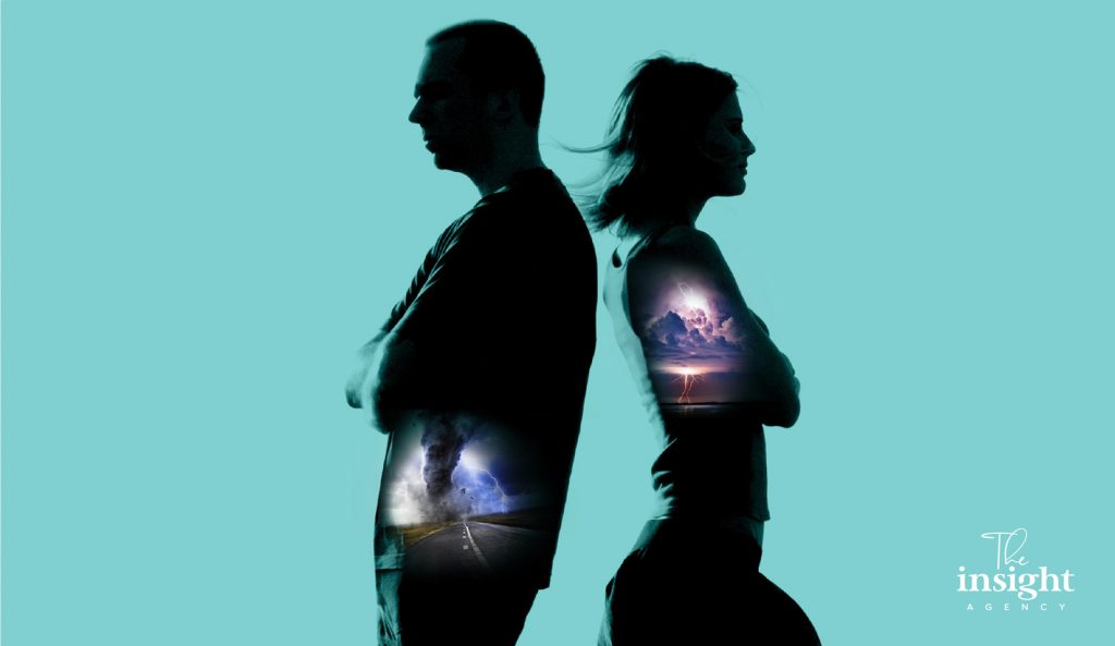 Two figures back to back in double exposure.